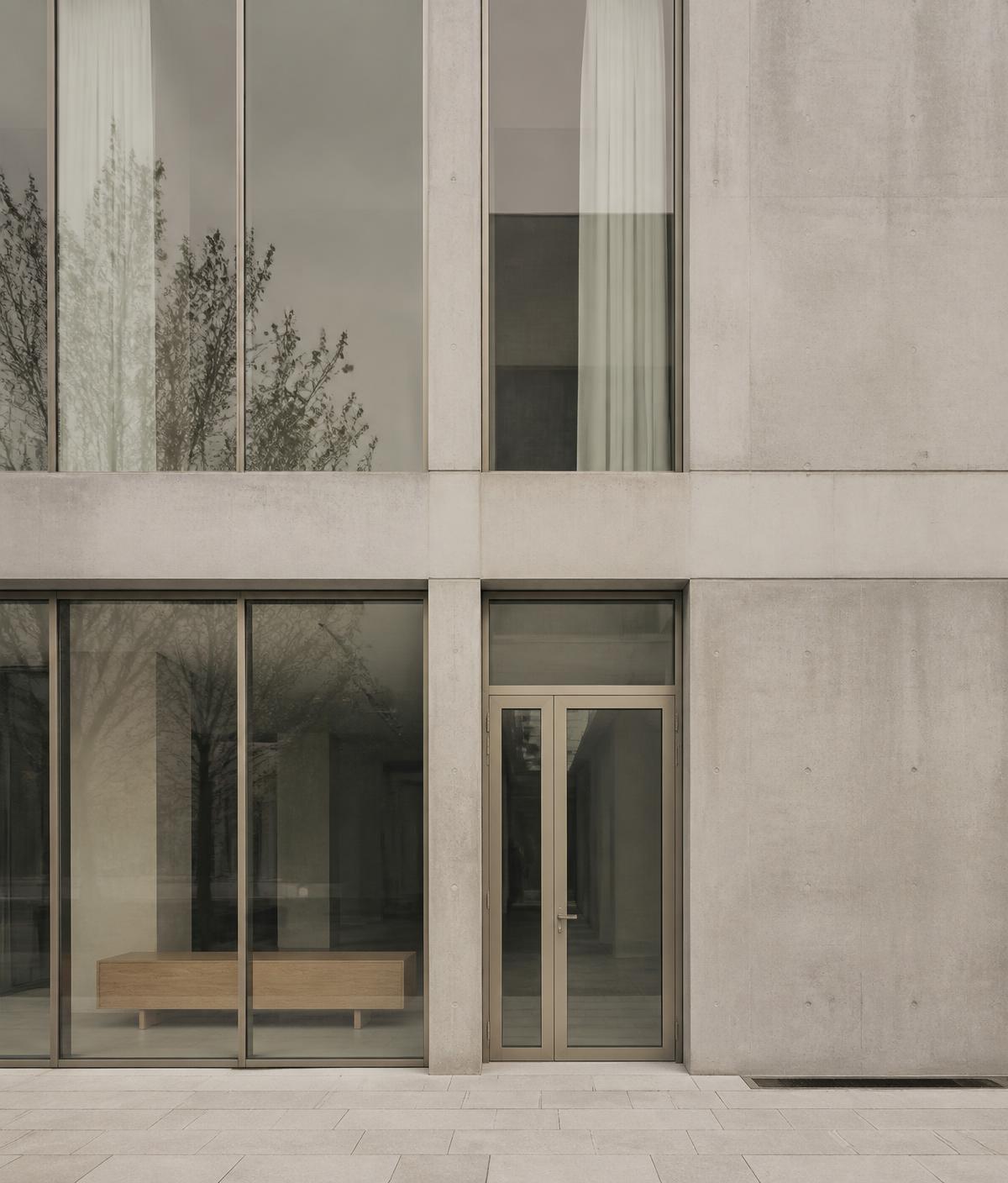 Concrete and glass office facade in soft Nordic daylight